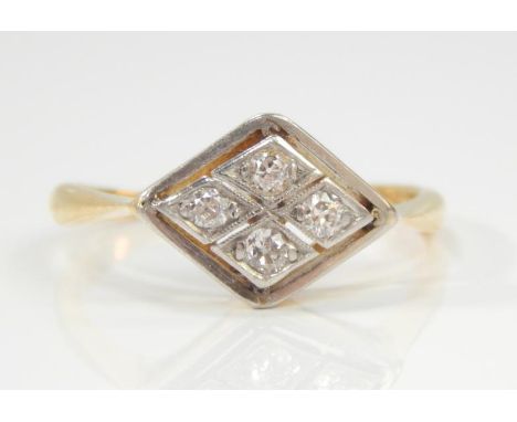 An Art Deco style ring, having four illusion set diamonds surrounded in white metal mount in yellow metal shank marked 18ct a