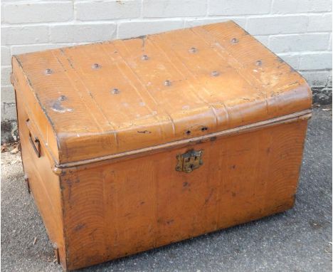 A mid 20thC tin shipping trunk, 72cm wide.