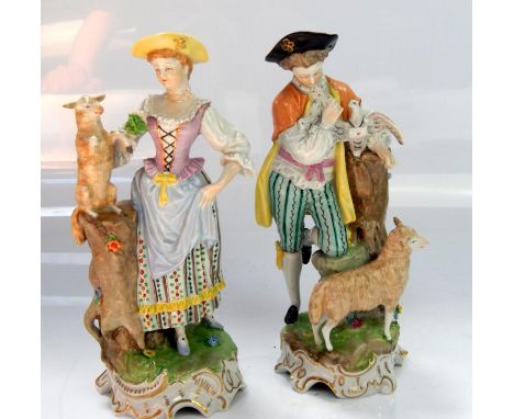 Two Dresden figures, of 18thC style man and woman with sheep upon countryside plinth, both 21cm high.