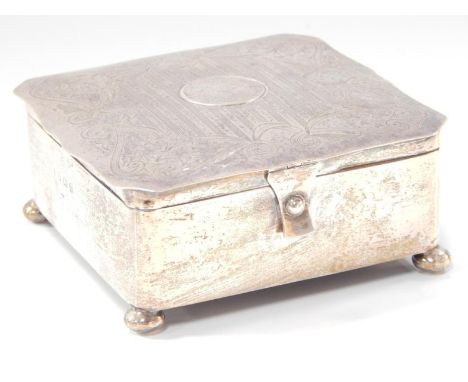 A George V silver jewel casket, of square shaped design, the hinged lid with engine turned and engraved swag decoration, with