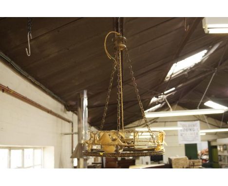 A 1920s brass light fitting, upon three chains with central fitting for three lights, 43cm dia.
