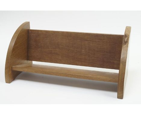 A Robert Thompson of Kilburn (Mouseman) oak book trough, with quarter circle ends, 45cm wide.