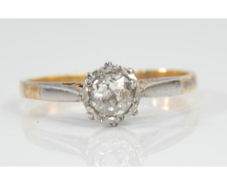 A diamond solitaire ring, with old mine cut stone in white metal crown setting, approx .35ct, in yellow metal shank marked 18