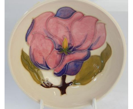 A Moorcroft pottery trinket dish, with yellow flower decoration, 12cm dia.