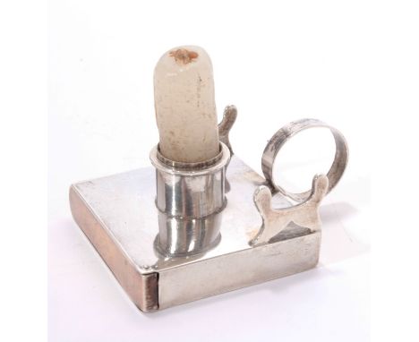 Unusual Edwardian miniature silver taper-stick of square form, with central candle holder and ring handle, lower match compar