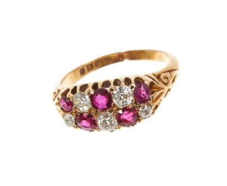 Edwardian diamond and ruby ring with two rows of old cut diamonds alternating with round mixed cut rubies in claw setting, ca