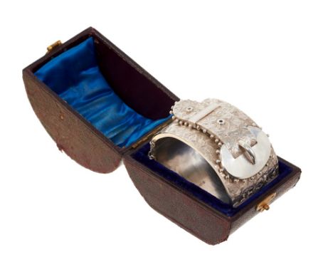 Victorian silver cuff bangle, the wide hinged bangle with three dimensional buckle design and engraved decoration, in a Victo