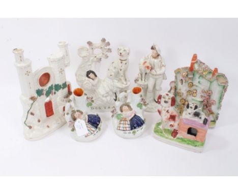 Three Victorian Staffordshire dog related pottery figures, pair 'Babes in the wood ' spill vases and two architectural flat b