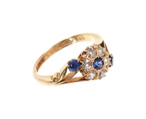 Antique sapphire and diamond cluster ring, the flower head cluster with a central blue sapphire surrounded by six old cut dia