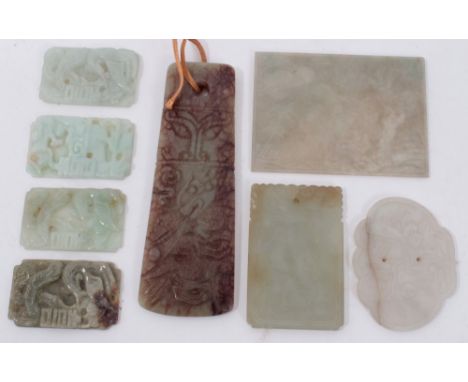 Group of eight jade or Chinese hardstone plaques, the largest a mutton plaque of blade form, 8cm long