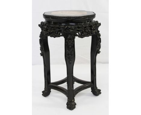 Late 19th/early 20th century Chinese carved hardwood and marble inset urn stand, with octagonal shaped marble inset top on ca