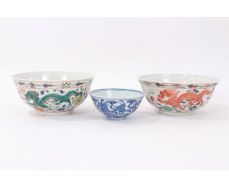 Pair of 20th century Chinese porcelain bowls, painted in polychrome enamels with a dragon and phoenix pattern, with character