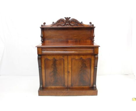 William IV mahogany chiffonier, with acanthus carved cresting, shelf back raised on turned spindles, having cushion frieze dr