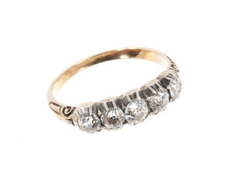 Mid Victorian diamond five stone ring with five old cut diamonds in silver collet setting, carved shoulders on gold shank. Es