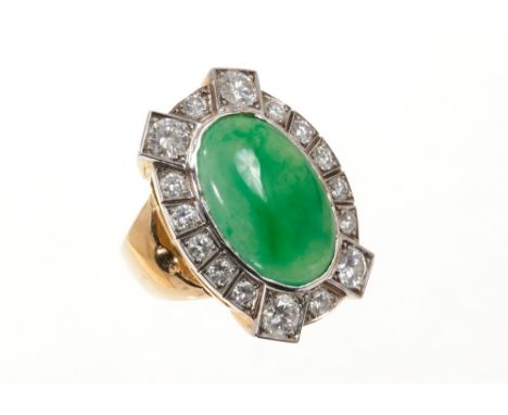 Jade and diamond cluster ring with an oval green jade cabochon surrounded by brilliant cut diamonds in 18ct gold setting. Fin