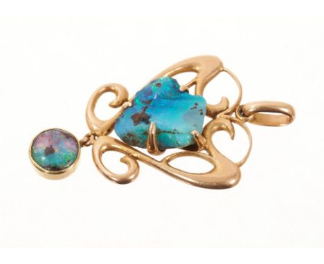 Art Nouveau 15ct gold and opal pendant in the manner of Archibald Knox, with a central natural free-form opal within gold scr