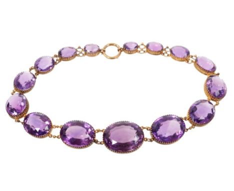 Victorian amethyst rivière necklace with 15 large oval mixed-cut amethysts in yellow metal claw setting, in fitted box. Large