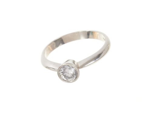 Diamond single stone ring with a brilliant cut diamond estimated to weigh approximately 0.45cts in collet setting on platinum