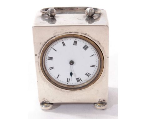 Early George V dressing table clock, with timepiece movement and white enamel dial, with Roman numerals, in a silver case, wi