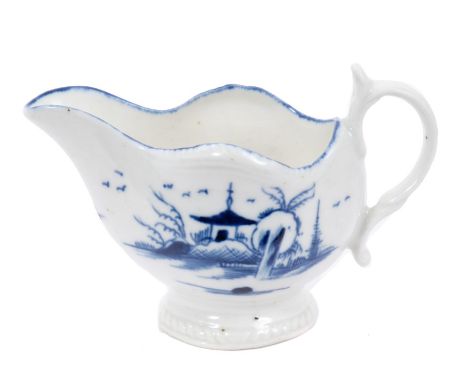 Late 18th century Caughley cream boat, painted in underglaze blue with the Island pattern, 6.5cm height.