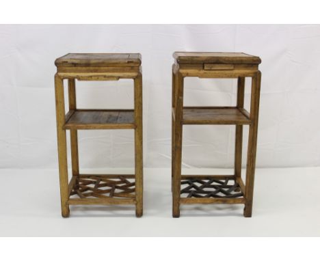 Pair of antique Chinese elm urn stands, each with square top, shelf and lattice undertiers between square supports, 40cm wide