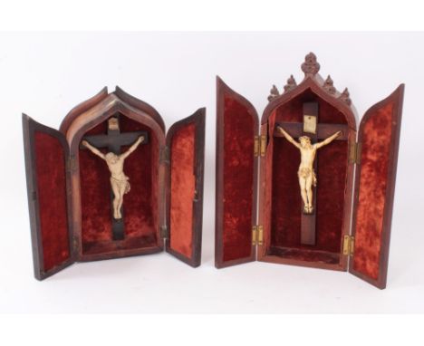 19th century carved ivory crucifix, the figure approximately 14cm high, in folding Gothic mahogany arched case, together with