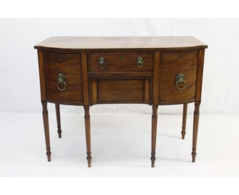 George III bowfronted sideboard, with frieze drawer over recessed apron drawer and flaking cupboard and cellarette drawer, wi
