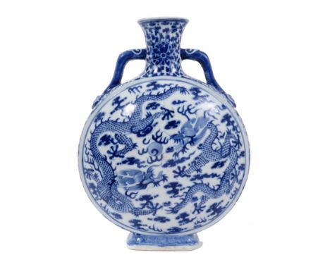 Chinese blue and white porcelain moon flask, painted with dragons chasing a flaming pearl, the handles in the form of ruyi sc