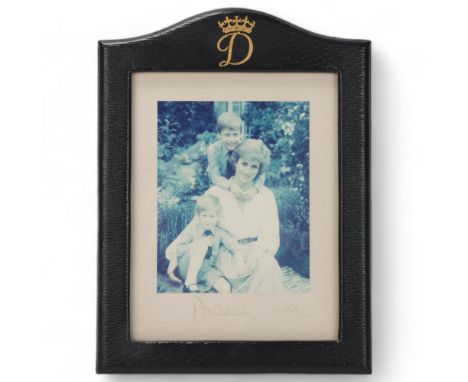 Diana, Princess of Wales, photograph portrait of Diana with Princes William and Harry, signed in pen below the image "Diana 1