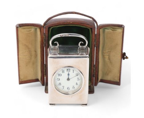 Late Victorian silver carriage clock, enamel dial with glass front and scrolled swing handle, by Goldsmiths & Silversmiths Co