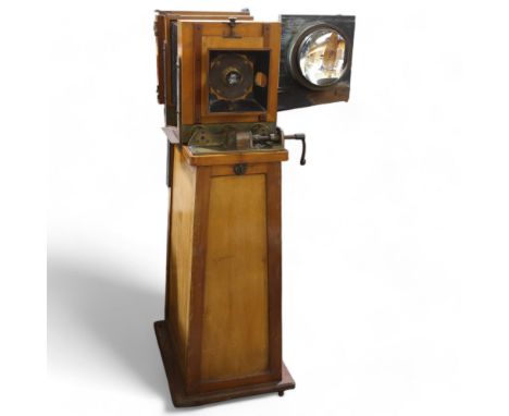 A large Victorian floor standing studio camera, mahogany and brass, with inter-changeable plate sizes to full plate, a hinged