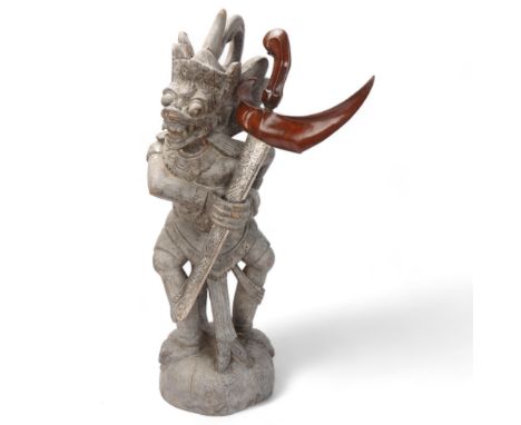 A Malayan carved wood grotesque figure Kris stand, together with a Kris dagger in white metal scabbard, figure height 62cm 