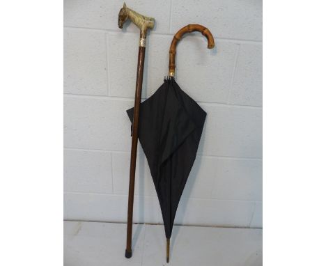 Black umbrella with 9ct Gold band along with a walking stick with resin carved horse handle