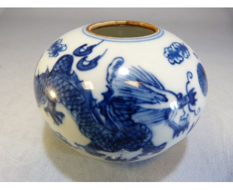 Chinese Blue and White small vase depicting a pair of dragons contesting the flaming Pearl. Two circles to base possibly Kang