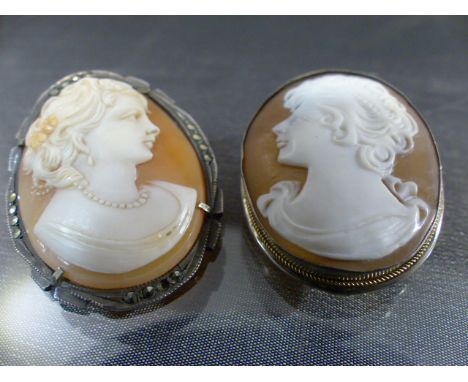 Two silver Vintage cameo brooches (1) measuring approx 33mm x 25.25mm across, female head facing left. (2) measuring approx 3