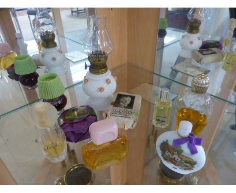 Small collection of vintage perfume bottles and a miniature oil lamp