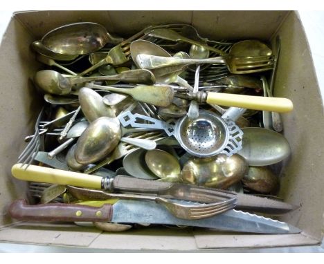 A collection of silver plated flatware, including sugar nips, carving items, spoons, a tea strainer and more (parcel)