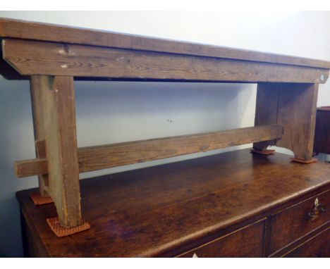 An early 20th century pine peg bench.   133cm H