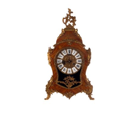 A French Rococo ormolu mounted Kingwood clock and bracket, the case having inlaid floral marquetry, with applied ormolu decor