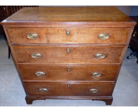 A George III oak chest of four graduated drawers, on square bracket feet.  94cm W