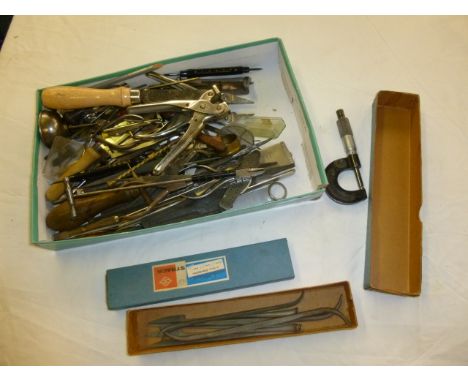 A good collection of watch makers hand tools, including various small weight hammers, a micrometer, new files, brooches and m