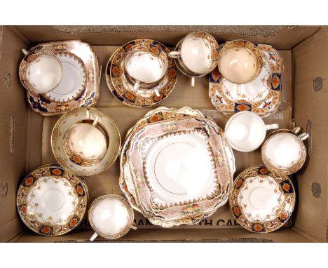A part ceramic tea service, decorated with blue and red glaze, heightened with gilt design, marked with a crown to the base, 