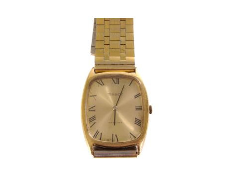 A Gentleman's Tissot Stylist yellow metal wrist watch, black Roman numerals to a gilt face on a gilt and white metal strap