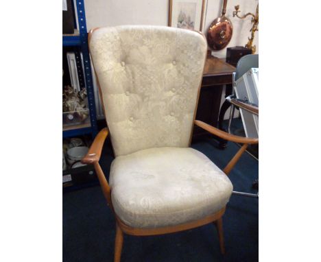 A high back Ercol armchair, with added button back cushion and seat, upholstered in pale green material