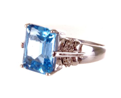 A 9K marked gold and blue topaz dress ring, the step cut stone mounted in 9ct white gold, size O, approx. 5.3g