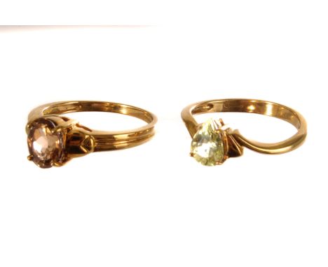 A 9ct gold and pear cut yellow garnet dress ring, together with a 9ct gold oval cut topaz dress ring, both size N, approx 5.1