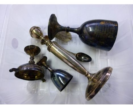Three silver trophies, including a goblet, an egg cup and a twin handled example, together with a Georgian silver teaspoon an
