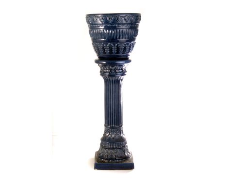 A blue ceramic jardinière and stand, the stand of column form, together with a green jardinière and stand (4)