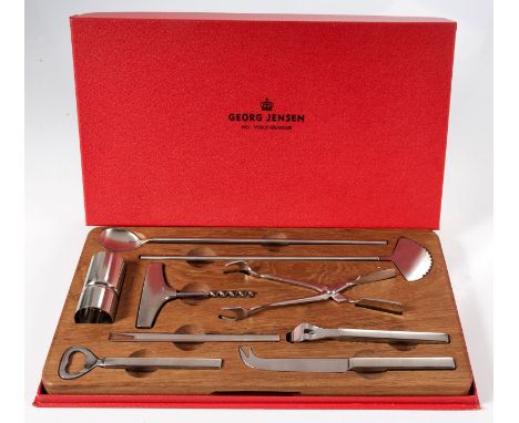 Comprising: a corkscrew, a bottle opener, a can opener, a cheese knife, a pickle fork, a pair of ice tongs, a double-sided to