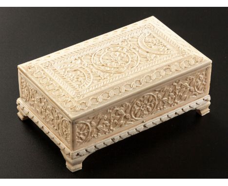 NOT SUITABLE FOR EXPORTThe rectangular casket raised on bracket feet with a removable lid, the entire surface carved with flo